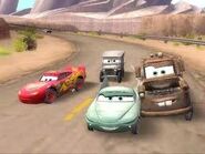 Flo racing against Lightning, Mater, Ramone, and Sarge.