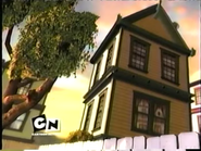 The outside of Tommy's house is shown.