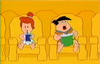 Freddy and Wilma are watching a film. A monster roars which scares Freddy and causes him to throw the popcorn which blends into a Cartoon Network logo.