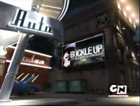 Behind the bank, there is a billboard with Grim on it saying "Buckle up".