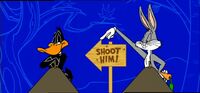 Daffy is aimed at by a shotgun (presumably by Elmer Fudd) and puts up a "Shoot him!" sign pointing to Bugs, who simply twists the sign back in Daffy's direction. Daffy, apparently not noticing the switch, blows a raspberry at Bugs right before he gets his feathers blasted off. This was the show's only "We'll Be Back" bumper used after 2002.