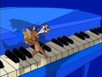 Jerry is sneaking away with some cheese on a piano when Tom pounces. Tom misses and instead gets the piano keys in his mouth. This was the show's only "We're Back" bumper used after 2002.