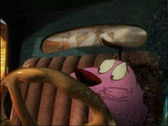 Courage tries to start the car while Eustace yells at him.