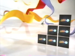 2000-2003: White set with oversised red, blue, and yellow ribbons and six monitors.