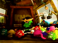 Numbuh 3 stacks her Rainbow Monkeys, which then fall over.