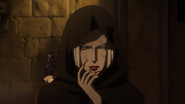 Carmilla shrouded in black robes