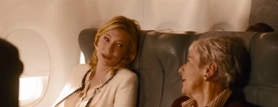 Jasmine tells her life to the passenger sitting next to her