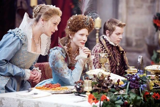 During a reception for the young Archduke of Austria, Elizabeth I, sitting with him at the dinner table, refuses quickly to the idea of marrying him.