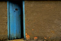 96548-stock-photo-blue-dark-wall-building-door-mysterious-gate