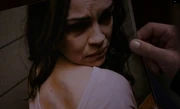 Violet's bruises from Kitty's beating.