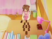 Sakura using the Clow Cards for fortune telling.