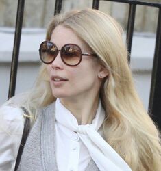 Claudia Schiffer wearing a pair of diamond-set stud earrings.