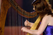 Playing the harp in "A New Journey"