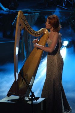 Órla performing in a golden dress.jpg