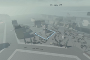 Development screenshot of a park within Talona, featuring a large monument.