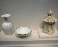 A qingbai porcelain vase, bowl, and model of a  with transparent blue-toned glaze, from the period of the  (960-1279 AD).