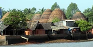 Brick and roof tile making kilns on a branch of the Mekong in the Delta region of Vietnam.