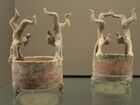 Two Western Han Dynasty terracotta vases with acrobats