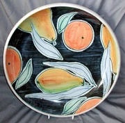 Contemporary tin-glazed pottery: a large plate by Daphne Carnegy, c