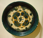 A ceramic offering plate with "three colors" glaze, decorated with a bird and trees, 8th century