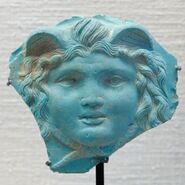 English: Gorgoneion (head of Medusa). Opaque glass paste, Roman work, 1st–2nd century AD. From Rome, middle 18th century.