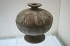 A painted pottery dou vessel with a dragon design from the Warring States Period (403-221 BC)