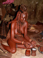 Himba lady preparing deodorant