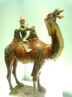 A Western on a Bactrian Camel, a sancai glazed figurine from the Tang Dynasty