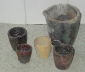  Several graphite crucibles of different sizes
