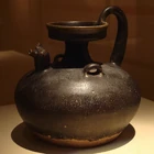 CMOC Treasures of Ancient China exhibit - black glazed jug with rooster head.jpg (1,39 MB) A black-glazed wine or water jug with a rooster-headed spout, Jin Dynasty (265-420)