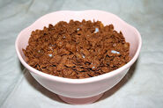 A bowl of Cocoa Pebbles in Milk.