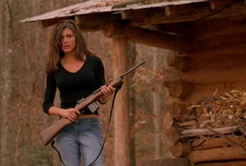 Marcy brandishing a gun to scare off the vicious dog - an image often used in promoting Cabin Fever