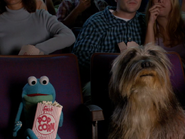 Croaker eating popcorn. He thought the popcorn was stuck to his teeth. For his anatomy appearence, he doesn't actually have teeth.