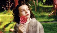 Veruca licking a swirlypop in the chocoate room