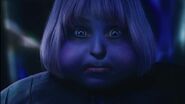 Violet’s eyes change from green to blue as her face swells up.