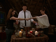 Phoebe and Piper trying to cast the spell with Paige in Henry's head.