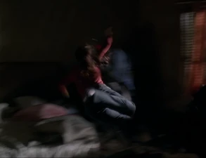 The Beast throws Piper on his bed, using Super Strength.