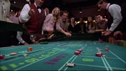 Ronny and Denise gambling in a casino.