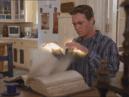 Leo searching the Book of Shadows