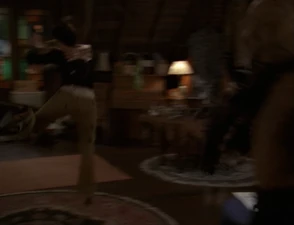 Phoebe is thrown across the attic as she is hit by the Manticores' Super Strength.