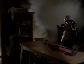Piper blows up a part of a wall in Derek's house.