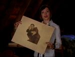 Paige holds the portrait to which Vaklav is now trapped