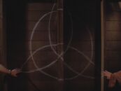 The triquetra used as a window to find Abraxas. ("Witch Trial")