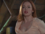 Paige orbing a crossbow into her hands.