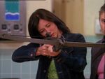 Prue picks it up and tries to shoot him with it.