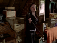 Paige holding a Shillelagh.