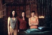 The Charmed Ones in front of the Grimoire