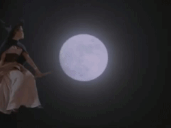 Phoebe flying on a broom.