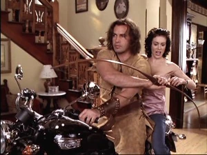 Drake and Phoebe on a motorcycle