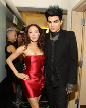 With Adam lambert